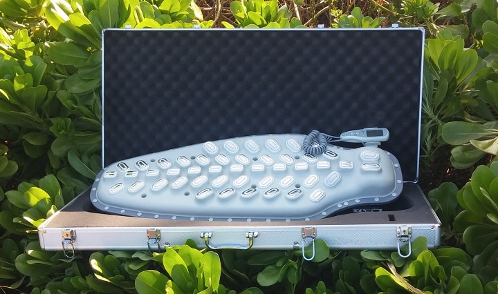 DENAS Vertebra 2 hard shell carry case as shipped from the manufacturer, opened to show the electrode array inside